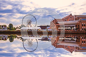 View of Gdansk, Poland during sunset with reflection in river