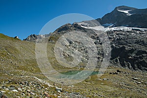 View of Giogo Lungo refuge near the glacier in the Italian alps