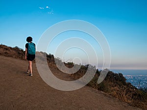 View of girl alone doing mountain hike