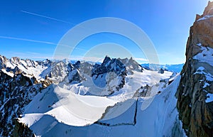 View of the glacier valley of the Mont Blanc massif seen from the Aiguille du Midi. French Alps, Europe.