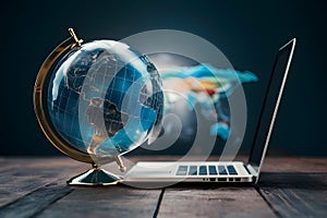 view Glass globe and laptop merge, symbolizing global business perspective