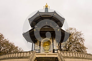 View of the golden Buddha in a Londons park photo