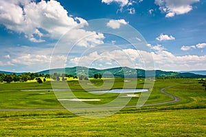 View of a golf course and distant mountains at Canaan Valley Sta photo