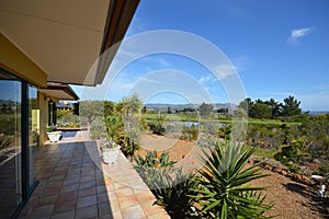 View of a golf course off a veranda