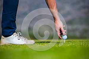 View of a golfer teeing off from a golf tee