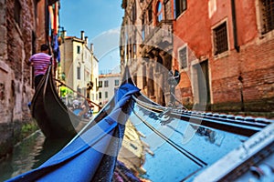 View from gondola during the ride through the canals of Venice i