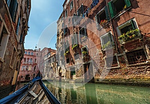 View from gondola during the ride through the canals of Venice i