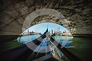 View from gondola during the ride through the canals of Venice i