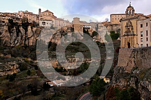 View of the gorge, overhanging cliffs and the building of the Antiguo Convento de San Pablo in Cuenca, Spain photo