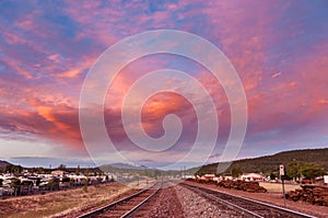 View of the gorgeous sunset over the railroad going into the hills