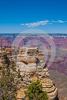 View of Grand Canyon`s Southern Rim from Mather Point with people at Yavapai Point