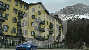 View of Grand Hotel Misurina located below most exciting ski resort in Dolomites