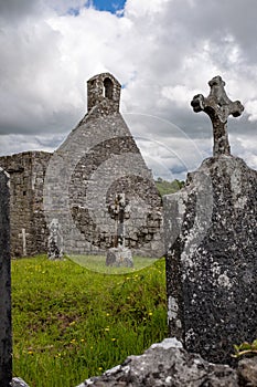 A view through grave stone of the abanoned ruins of Killone Abbey that was built in 1190 and sits on the banks of the Killone Lake