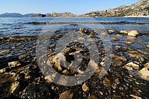Gravely and clear sea by seaside in Hisaronu, Turkey photo