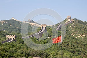 View of the Great Wall of China and the Chinese flag.