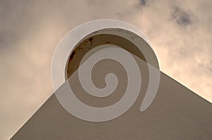 A view of a great white lighthouse of Cabo Ortegal in the Galician coast bathed by the Atlantic Ocean photo