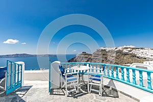 View of Greece Santorini, caldera view from restaurant, beautiful sea view and white architecture.