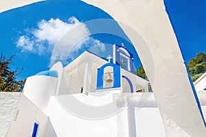 A view of a Greek church with iconic blue and white colors