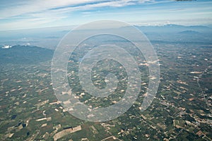 The view of green field and farm and city downtown in middle of Thailand. It shot from Jetplane