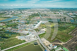 The view of green field and farm and city downtown in middle of Thailand. It shot from Jetplane photo