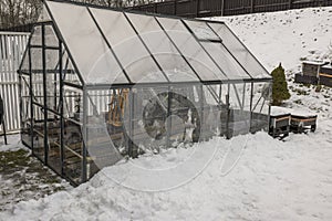 View of greenhouse with collected things for winter. Gardening concept.