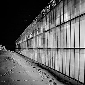 view of the greenhouse from the outside, all shining against the backdrop of snow and frosty night, providing strategic supplies