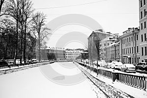 View of the Griboyedov Canal under the ice in winter, St. Petersburg, Russia..