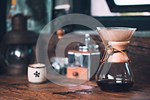 View of ground coffee pouring water on coffee ground with filter