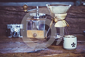 View of ground coffee pouring water on coffee ground with filter