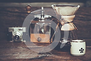 View of ground coffee pouring water on coffee ground with filter