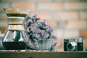 View of ground coffee pouring water on coffee ground with filter