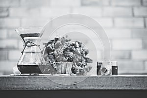 View of ground coffee pouring water on coffee ground with filter