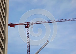 View from ground of two construction erection cranes 02