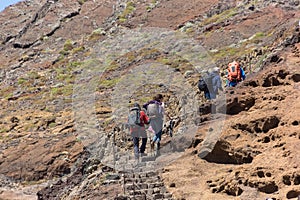 View of a group of tourists hiking in St. Lourenço Cape or Cabo de São Lourenço, on Madeira Island, Portugal