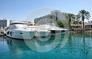 View of the Gulf of Eilat with luxury yachts. On the yacht you can sunbathe, jump into the open sea and enjoy drinks and fruits