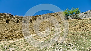 View of Gunibsky fortress. Protective wall and gates of Gunib. Russia, Republic of Dagestan
