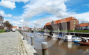 View of the habor an the historic warehouse in Toenning, Germany