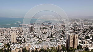 View of Haifa from the mountain. Residential buildings, streets, roads, port, sea. Panorama of the city