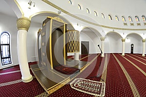 View of hall for praying iwan of the Ar-Rahma Mosque Mercy Mosque with minbar pulpit. Kyiv, Ukraine