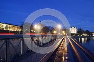 View of a hand railing on a bridge at night