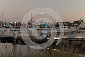 View of a harbor with boats and ships in the evening