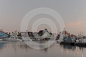 View of a harbor with boats and ships in the evening