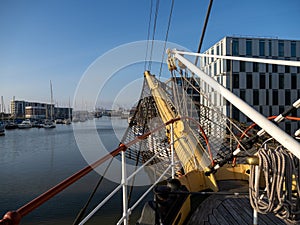 View of the harbor in Bremerhaven, Germany from the bow of a historic sailing vessel