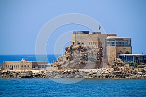 View of harbor of Caesarea Maritima where a restaurant is built on the site of the old Crusader-era citadel.