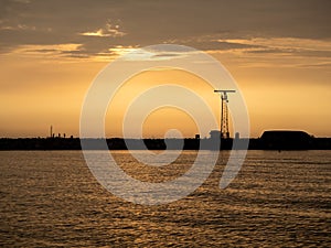 View of the harbor wall with anglers