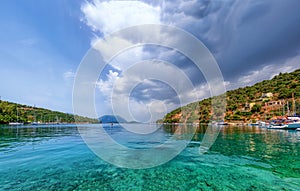 View on the harbour and island with mountains in Vathi village. Meganisi island Ionian sea