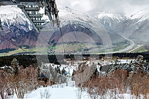 View from Hatsvali Khatsvali ski resort cableway in winter. Cables, forest and mountain Ushba. Mestia, Georgia