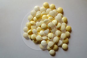 View of heap of round yellow xylitol mints from above