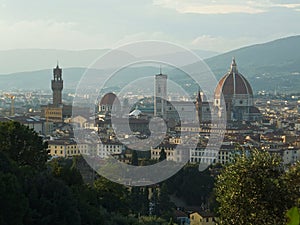 View of the heart of Florence: cathedral Santa Maria del Fiore and tower of Palazzo Vecchio taken from the other bank of the Arno