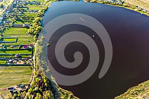 View from a height of a large rounded lake